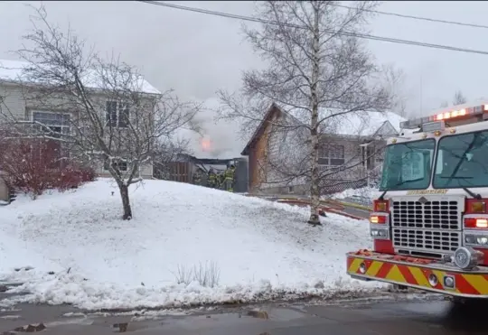 Fire destroys garage, damages home