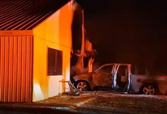 Fire damages garage and pickup truck