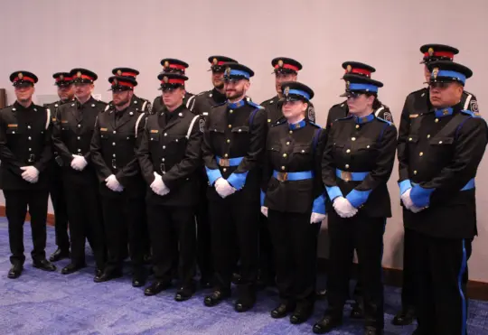 Police constables receive their badges