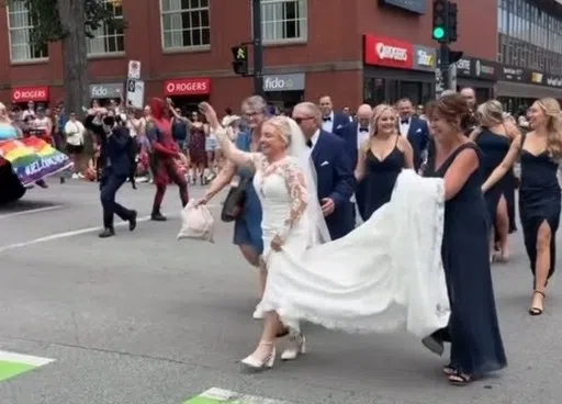 ‘Exhilarating’: Wedding party joins Halifax Pride Parade en route to venue