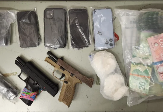 Guns, drugs, and $25k cash seized during police searches